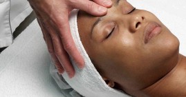 Black woman doing face yoga