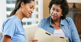 Woman talking to doctor about cholesterol
