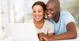Black couple using computer