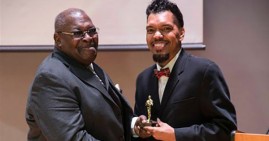 Composer Stu Gardner receiving award