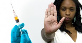 Black woman rejecting flu shot