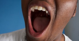 African American man gargling