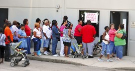 People in line to receive food stamps