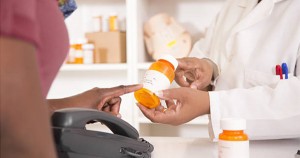 African American buying medicine