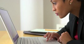 African American woman trading cryptocurrency online