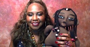 Dr. Cassandra George Sturges holding her Maggy Rag doll