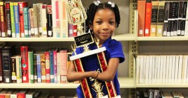 Anaya Ellick holding her award