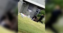Miami police officer kicks a handcuffed Black man in the head