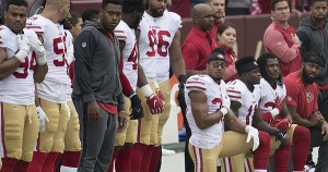 NFL players kneeling