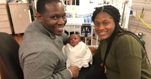 Ainsley Johson with his newborn baby and fiancee