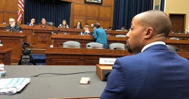 Charles Johnson IV sitting before Congress