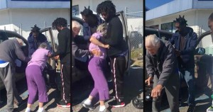 Three young Black men helping elderly couple