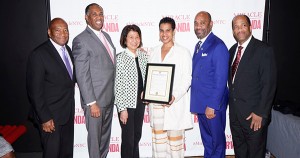 Leslie Lewis being honored as producer of Miracle in Rwanda