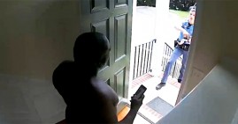 Kazeem Oyeneyin being detained by police in his home