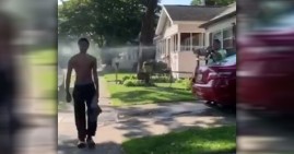 KKK Man sprays Black teen with water