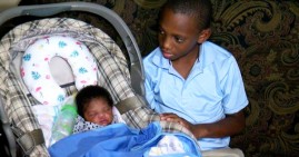 Lindell Lyons and his newborn sister