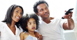 Black family watching streaming TV