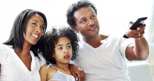 Black family watching streaming TV