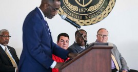 Simmons College president with Papa John's founder