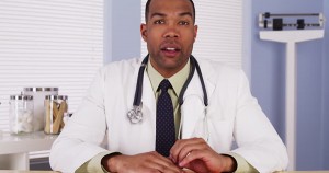 Black doctor in his office