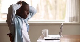 African American man concerned about debt