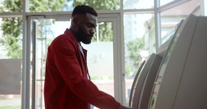 African American man getting cash