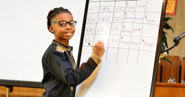 Kamari Chisolm discussing how to calculate gains/losses from stock purchases.