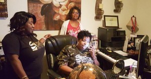 Shironica Roberts Jack, founder and CEO of Four Corners Travel and Cruises, with her staff