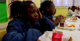 African American students eating school lunch