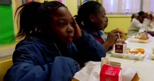 African American students eating school lunch