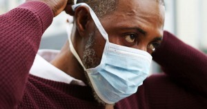 Black man with coronavirus wearing face mask