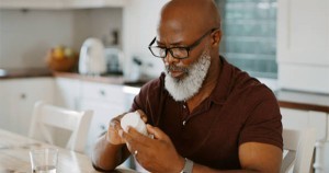 Black man taking ED herbal supplement