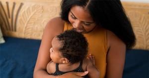 Black woman breastfeeding her baby
