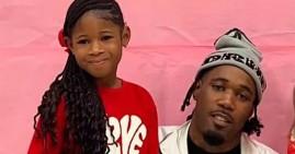 Rapper Lil Ronnie with his daughter