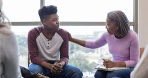 Black mental health therapist during a session