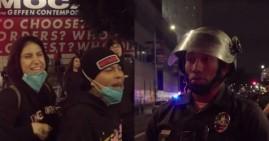 Latino protester and Black police officer in LA