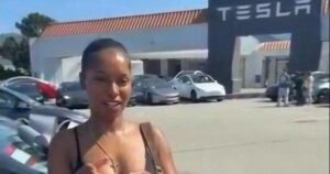 Woman buying Tesla car