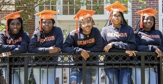 Young Black graduates from Icon Prep