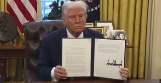 President Donald Trump signing executive orders on DEI policy